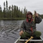 Boundary Waters Podcast host Joe Friedrichs catches a fish in the Boundary Waters Canoe Area Wilderness